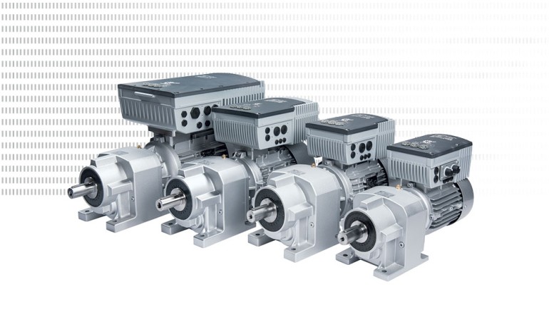 Four NORDBLOC.1 helical inline gear units with different case sizes of NORDAC FLEX VFDs on a white background.